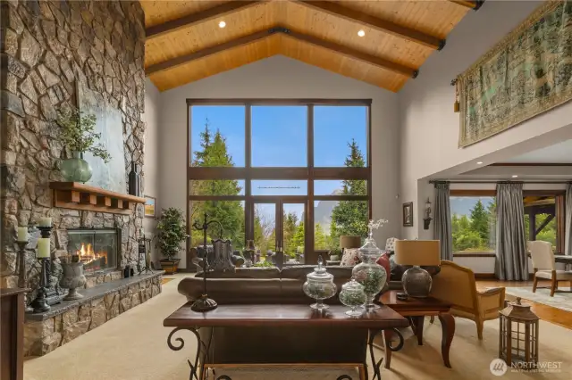 Exposed beams and tongue-and-groove ceiling give the living room a rustic feel and frame the Mt Si view perfectly.
