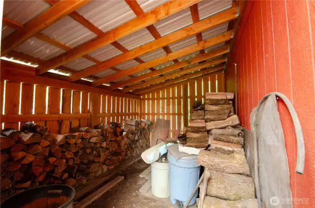 Covered wood storage off Garage.