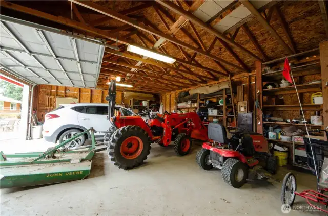 Plenty of space in the garage. Concrete floor. Built-in shelving.