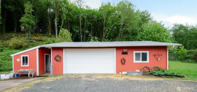 Garage with additional woodshed and storage room