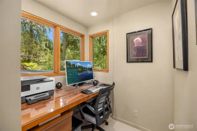 Office nook full of windows to take in the gorgeous gardens