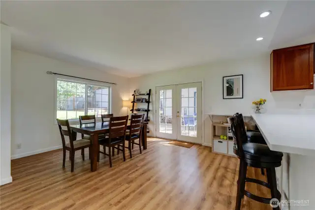 Spacious dining room with French doors leading to the covered patio & back yard.