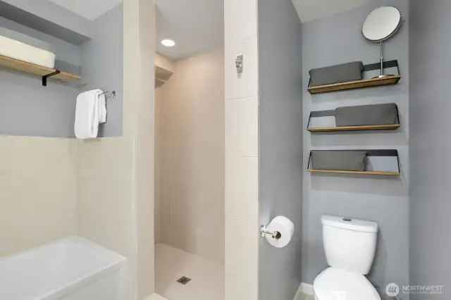 Primary bathroom has both a tub and shower.