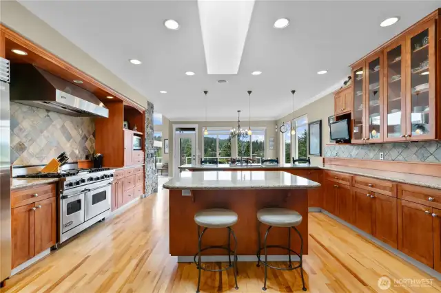 Dream kitchen with granite counters, Hickory floors & Birch custom cabinets with cherry finish