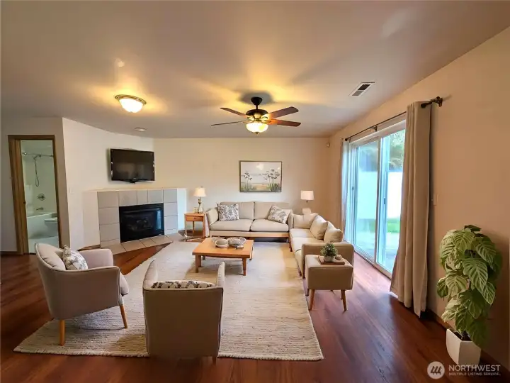 Family room - lower level. Virtually staged to show versatility