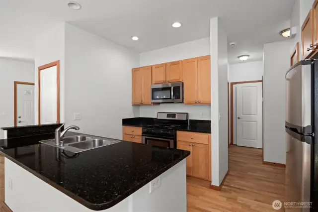 The kitchen is ideally located near the stairway, laundry room and half bath that is adjacent to the door that leads to the garage.