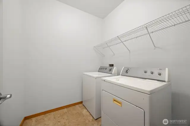 The laundry room is near the garage and kitchen on the main floor.