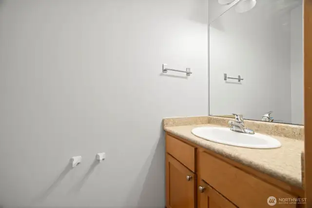 This half bath is on the main floor and adjacent to the garage.