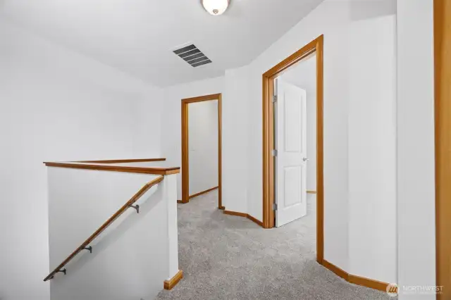 The bonus room is the left with the primary room having the French doors to the right.