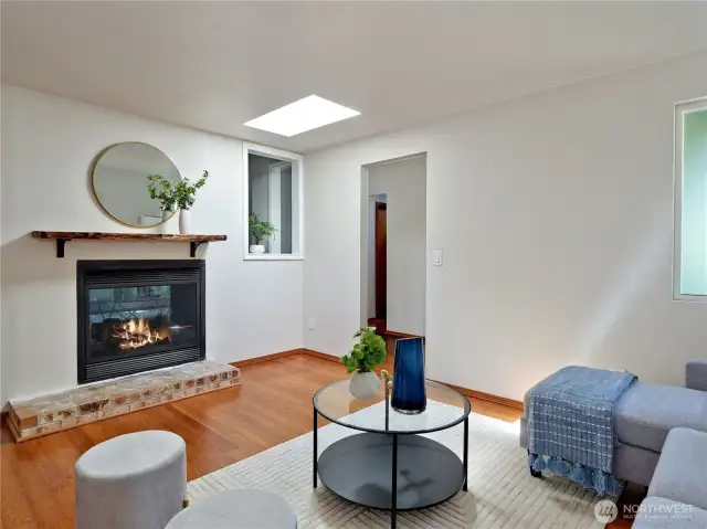 Family room side of fireplace, brick hearth and wood mantle