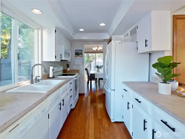 Kitchen with all appliances, pull- out drawer cabinets and deep sink.   Second panry at far end