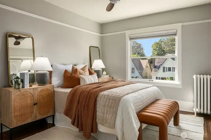 Spacious bedroom with large closet and hardwood floors.