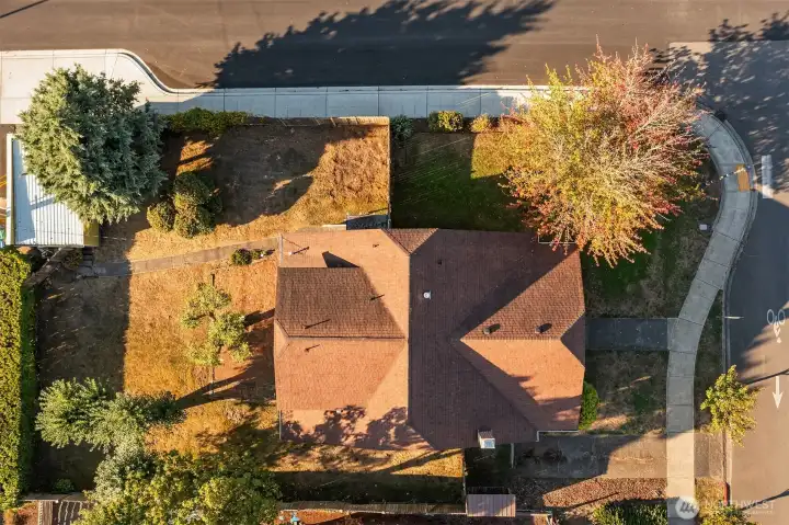 Two places for off-street parking; the one-car garage, seen in the upper left, and the paved driveway, seen in the lower right.