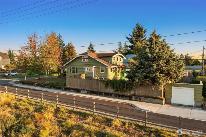 One car garage was recently re-shingled. Dormer is the upper level primary suite the current owners added.