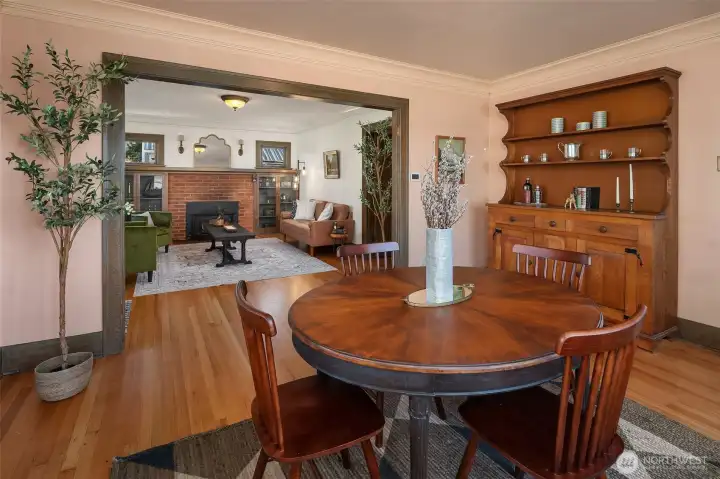 Gracious dining area sits between living room and kitchen. Note all the original millwork and the original hardwood floors. This is a rare find!