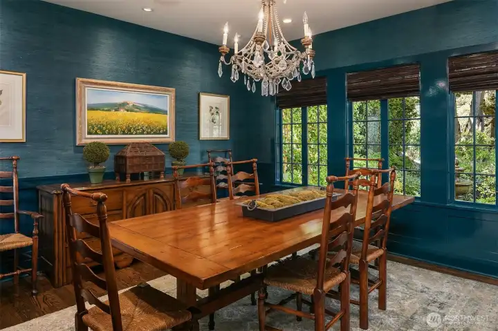 Dining room with lacquered walls and garden views.