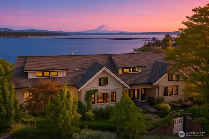 A soft palate illuminates the grand home perched with enchanting views.