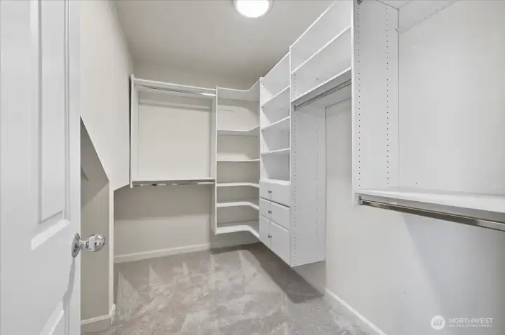 Oversized primary walk-in closet with plenty of extra storage