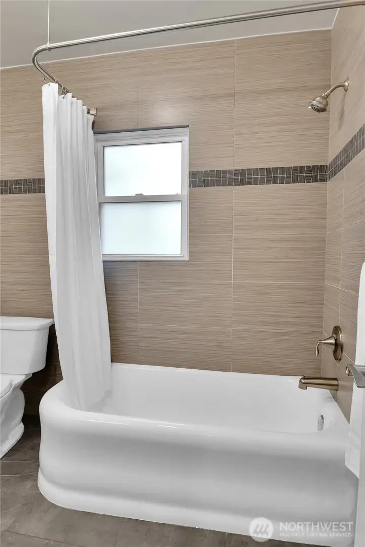Main floor bathroom with original tub