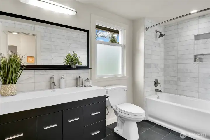 Upstairs guest bathroom is adjacent to the 2 guest bedrooms, There are four updated bathrooms and generous bedrooms ensure comfort for everyone.