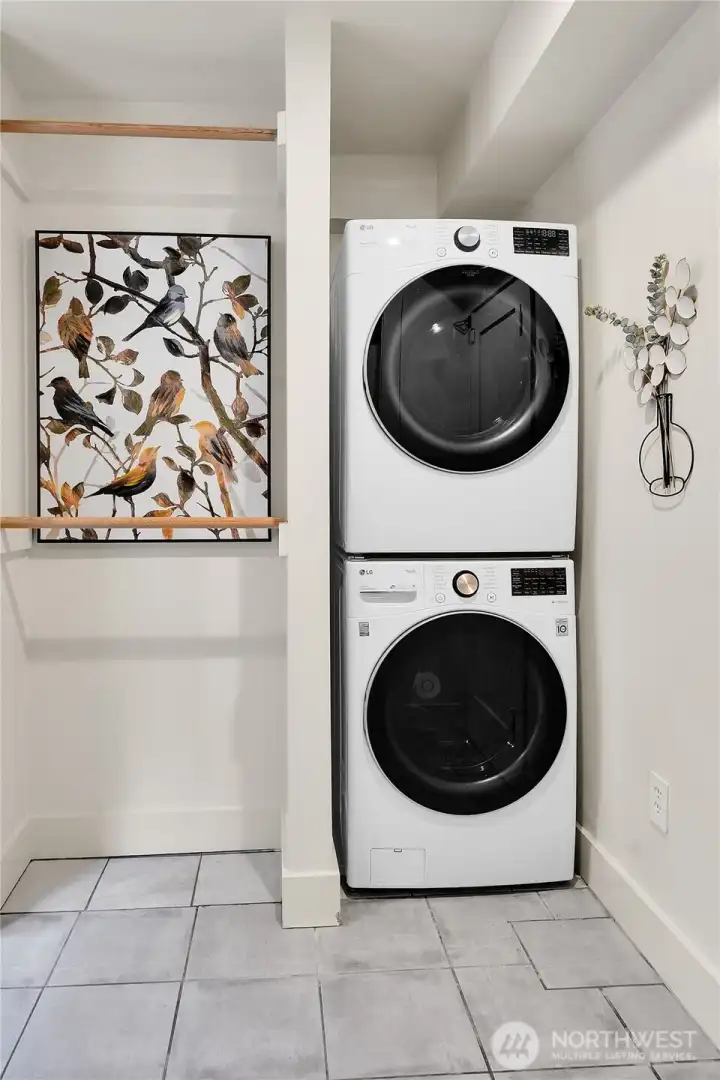 Located between the Kitchen and attached garage is a spacious utiltiy/mud room with laundry, pantry and entrance to the ADU