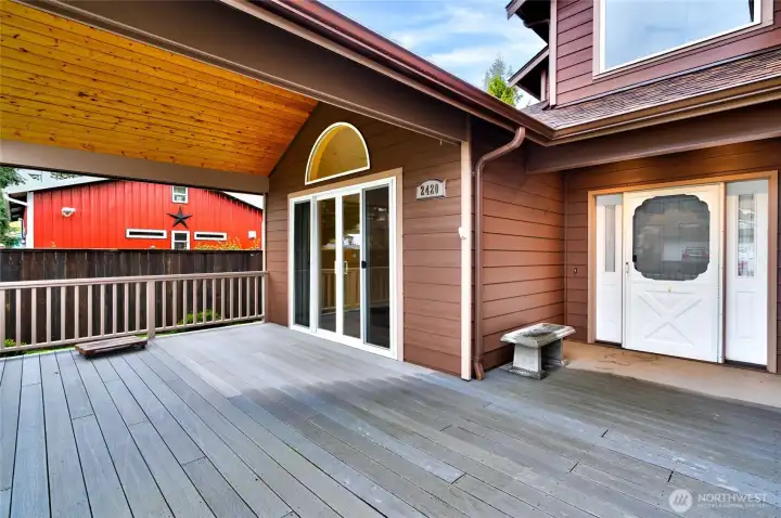 Welcoming covered front deck with cedar lined ceiling