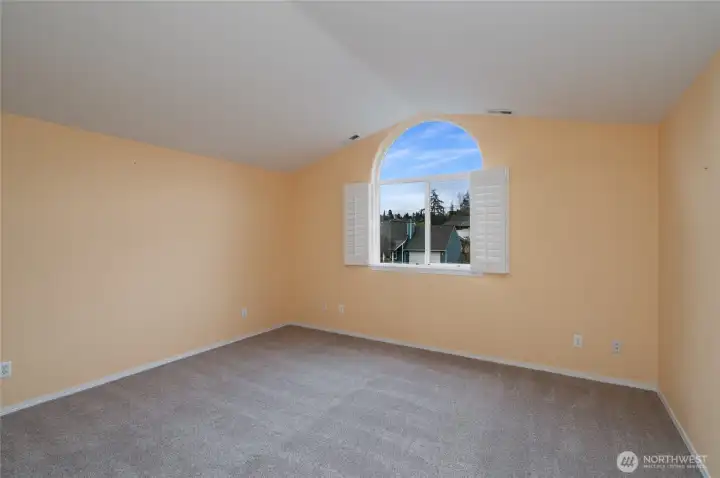 Primary bedroom with new neutral carpeting