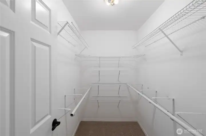 Primary bedroom walk in closet