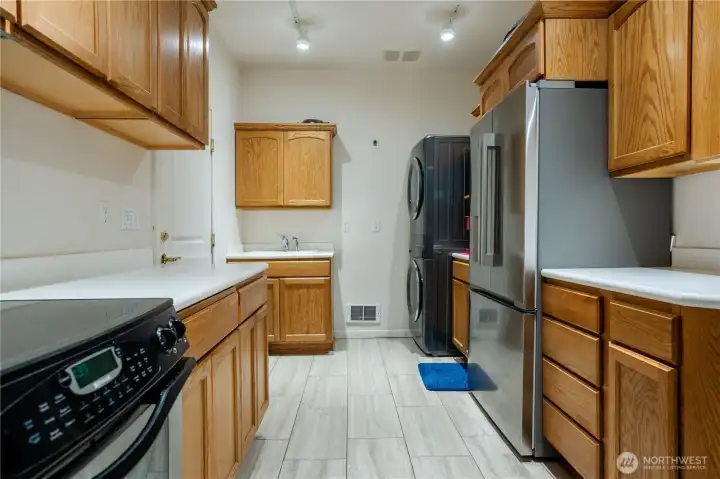 Solid Oak cabinets and tiled flooring.