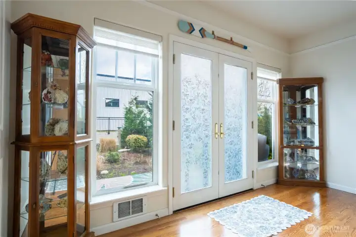Double doors leading to outdoor patio.