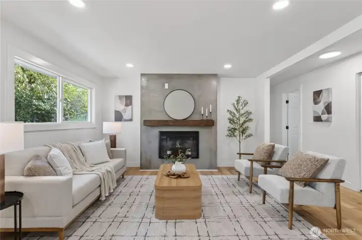 Enter the home and find the living area to your left, complete with a cozy electric fireplace perfect for relaxing evenings.