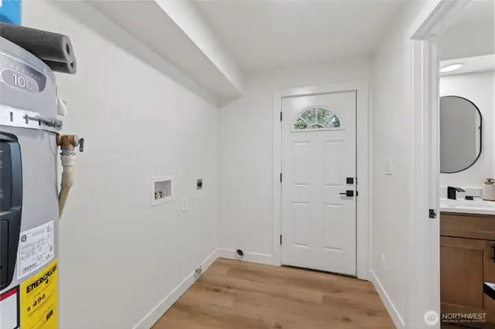 A smart utility space with outdoor access and laundry hookups—ideal for managing muddy shoes, pets, or gear.