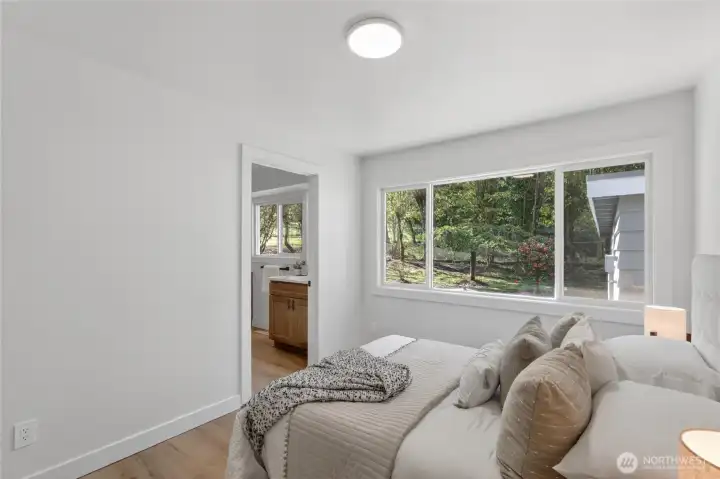 Enjoy backyard views from the comfort of the primary bedroom.