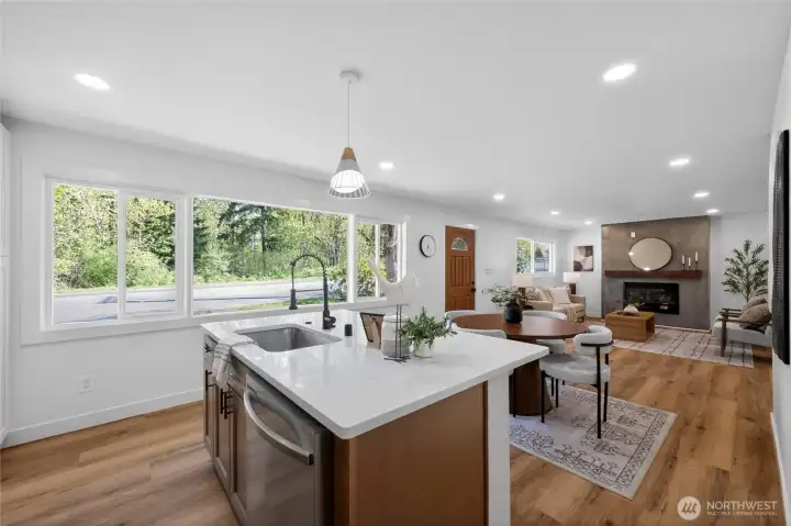 The open-concept kitchen offers a bright and functional space for cooking and gathering.