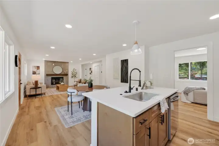 At the heart of the kitchen, a large center island provides both functionality and a natural gathering space.