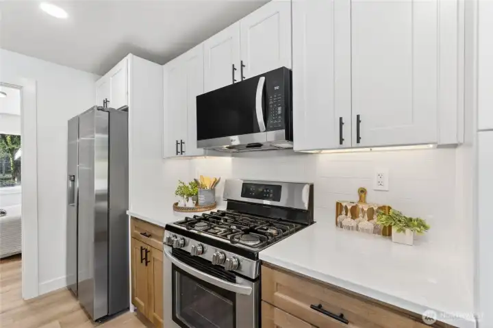 The kitchen is equipped with durable and stylish stainless steel appliances.