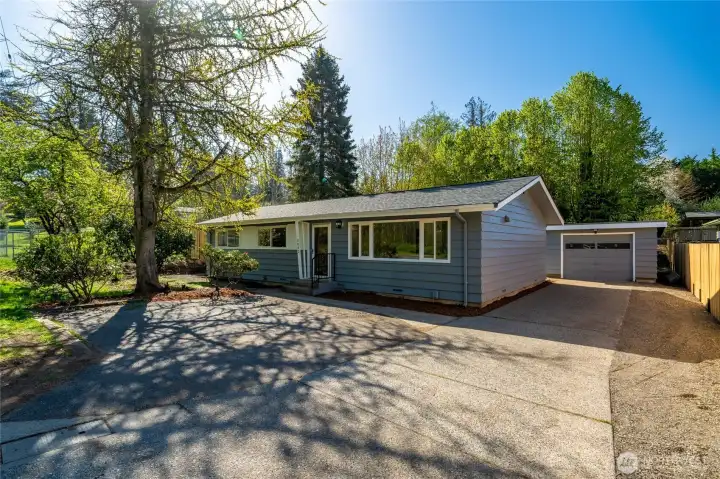 Space outside the garage allows for additional parking or a convenient turnaround.