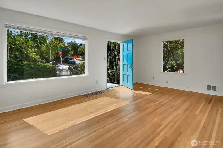 A large west-facing window fills the living room with light. A large west-facing window fills the living room with light.