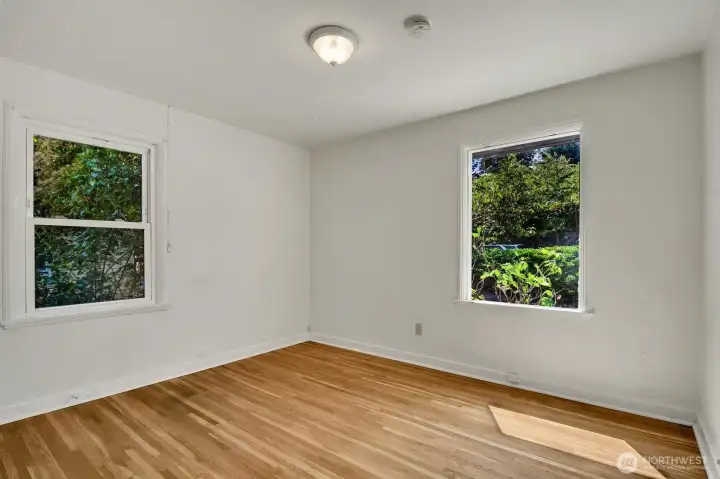 Main floor bedrooms feature 3-panel doors with original hardware. Main floor bedrooms feature 3-panel doors with original hardware.