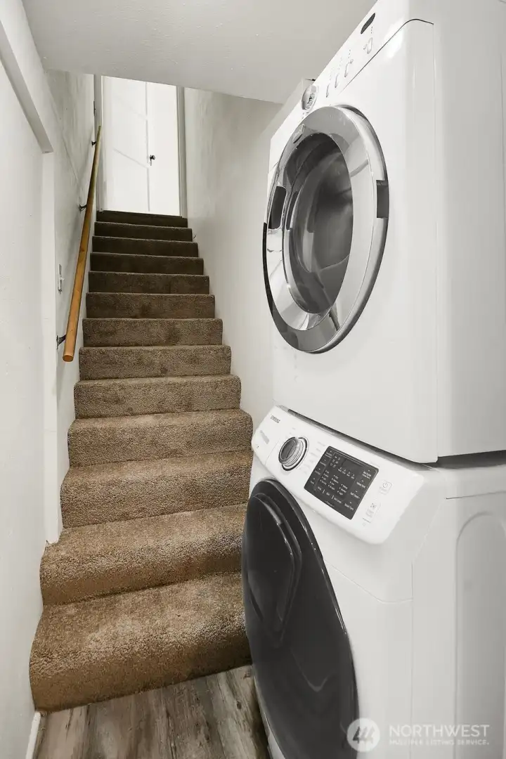 Full-sized laundry at the bottom of the stairway to the lower level. Full-sized laundry at the bottom of the stairway to the lower level.