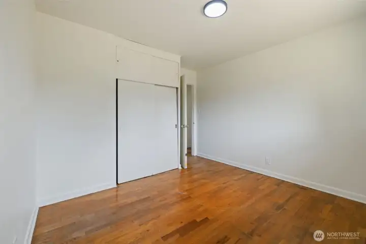 Door view of 1st secondary bedroom acroos from bathroom.