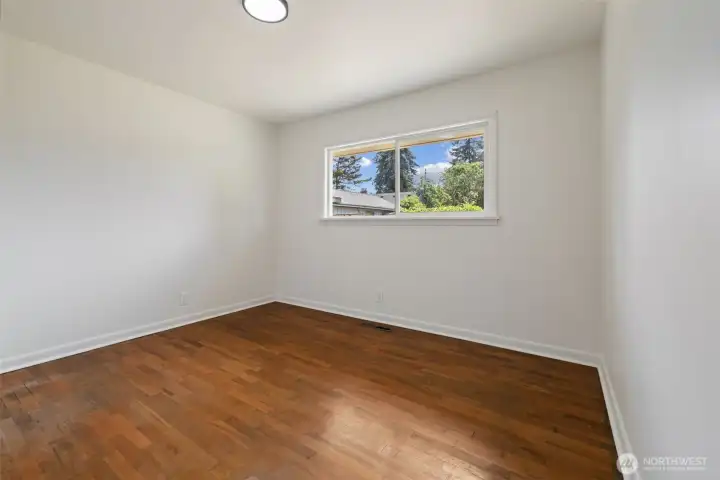 Window view of primary bedroom.