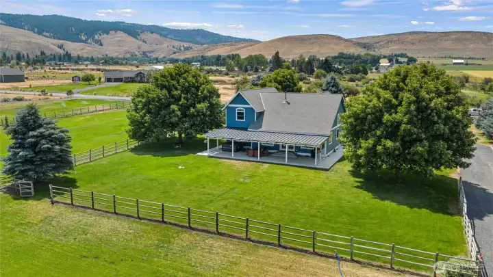 5 acres of lush fully irrigated green pasture.