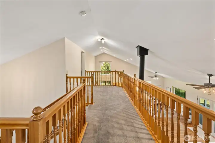 Upstairs balcony that leads to bathroom, 2 bedrooms and a bonus room!