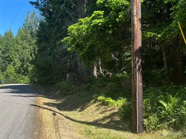 North facing view on Ridge Ln iwth power at the corner