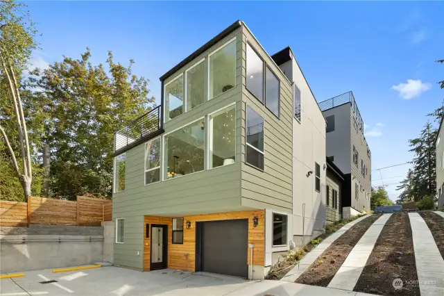 Sleek modern home with expansive windows and contemporary design, offering ample natural light.