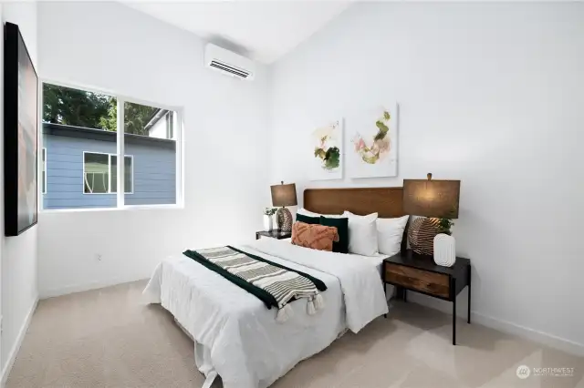 Spacious additional bedroom with a calming atmosphere and ample natural light.