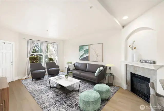 Enter into a spacious living room with fireplace and plenty of sunlight to brighten any day. Newly installed LVP flooring throughout adds to the light airy living! (Virtual Staging)