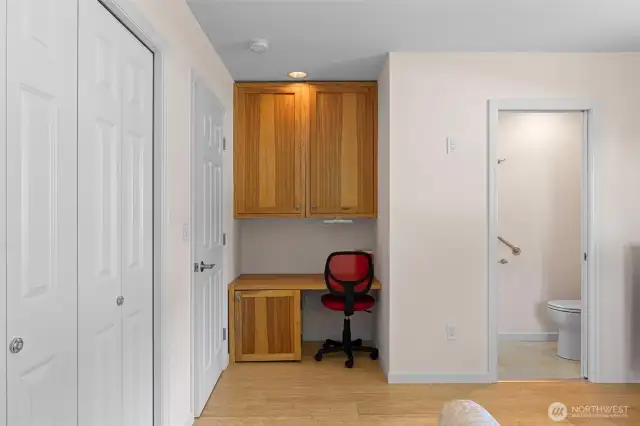Great hickory desk area in primary with cabinet for safe