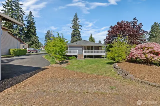 Garden beds, beautiful mature landscaping and tons of space for you to use your imagination